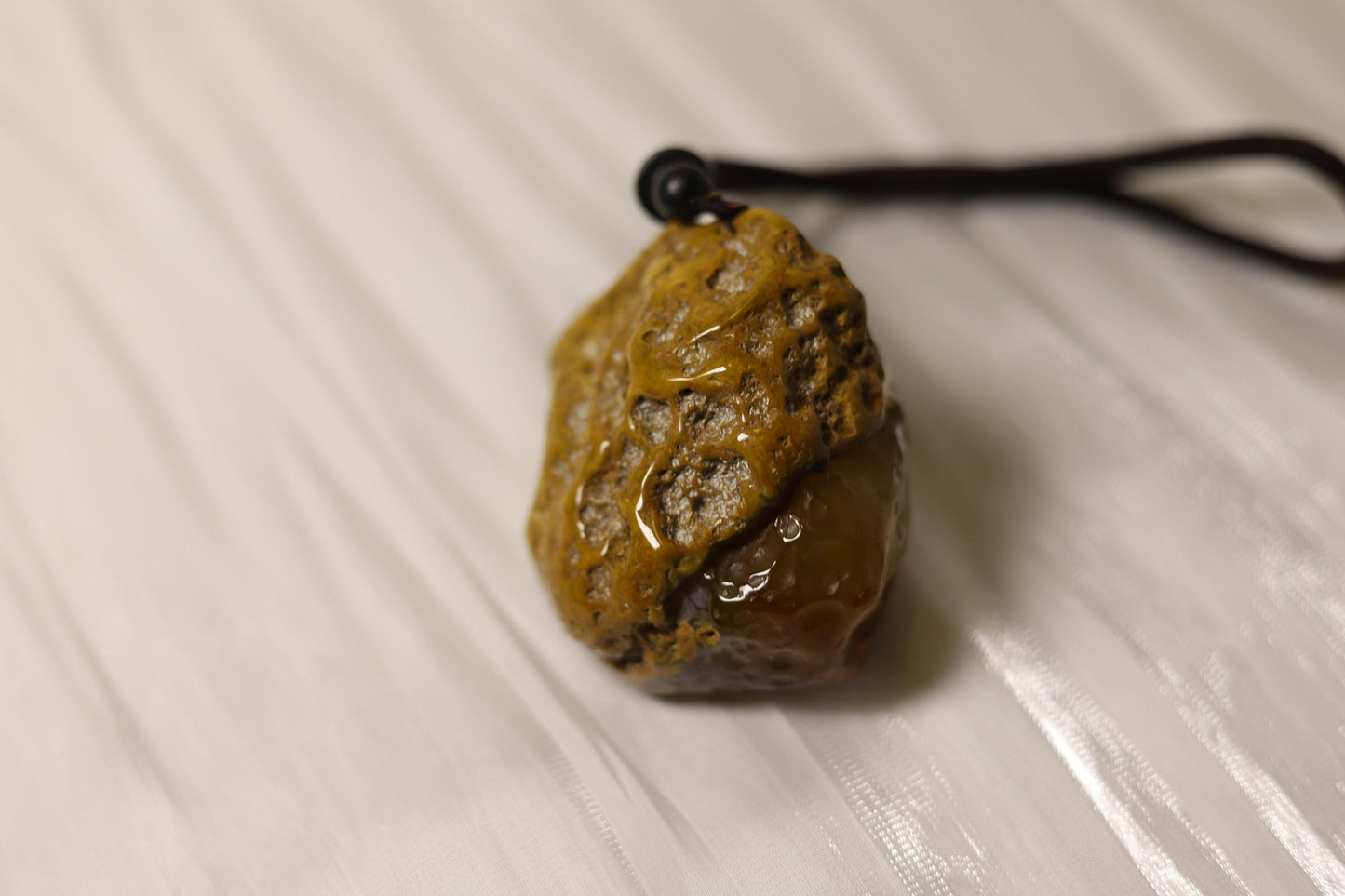 Hand-Carved Agate Pendant: Rustic Brown Sculpture, Polished Interior