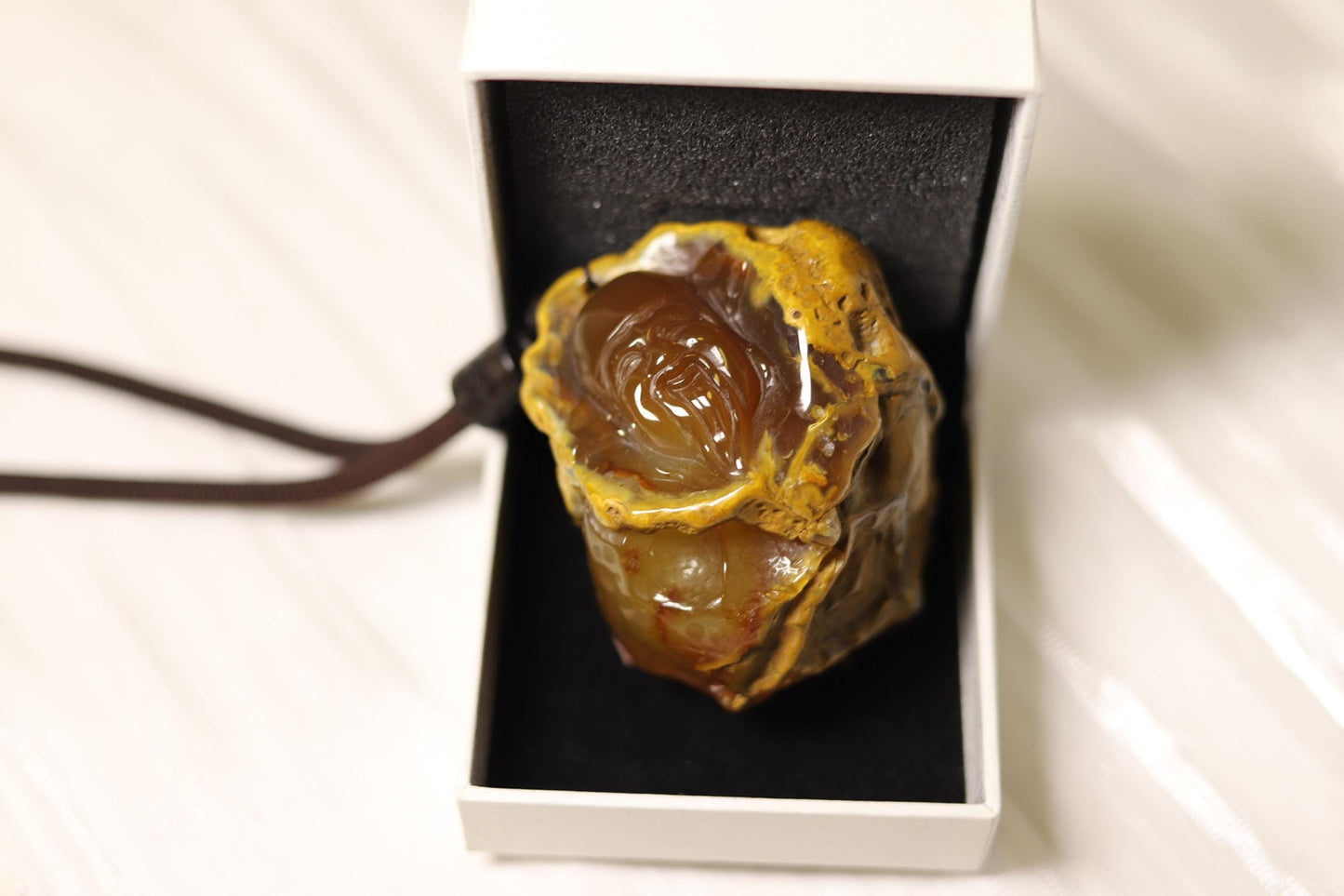 Hand-Carved Agate Pendant: Rustic Brown Sculpture, Polished Interior