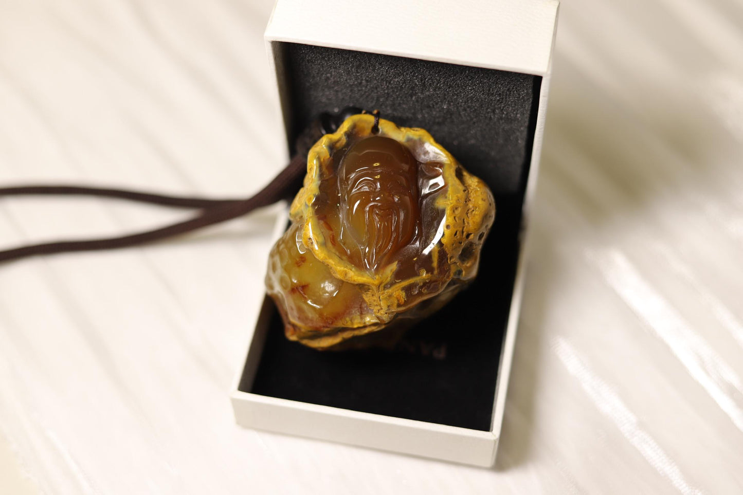 Hand-Carved Agate Pendant: Rustic Brown Sculpture, Polished Interior