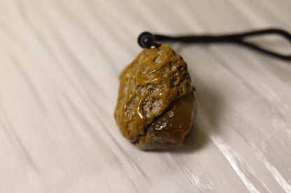 Hand-Carved Agate Pendant: Rustic Brown Sculpture, Polished Interior