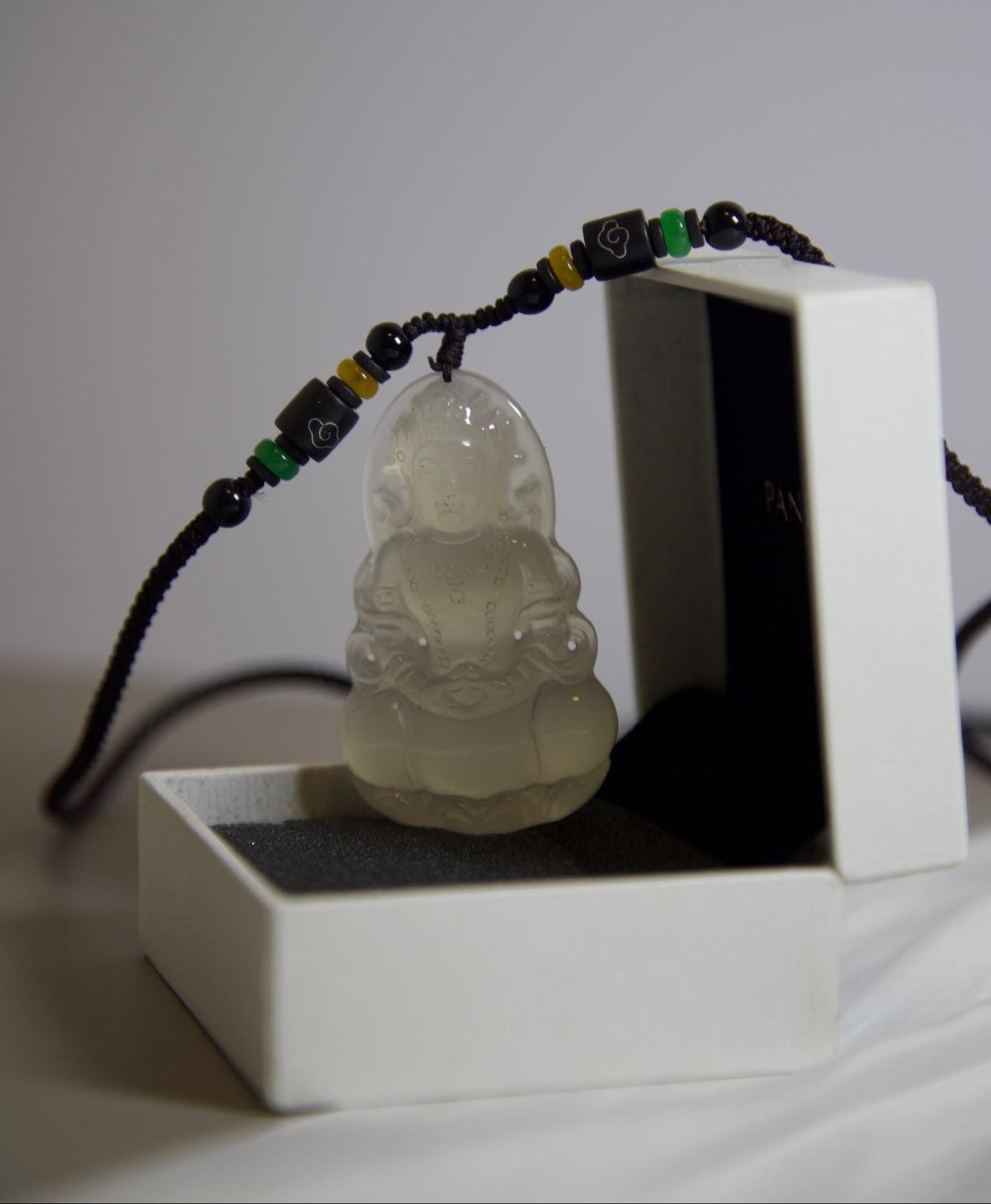 Hand-Carved Clear Jade Guanyin Pendant: Beaded Cord Amulet
