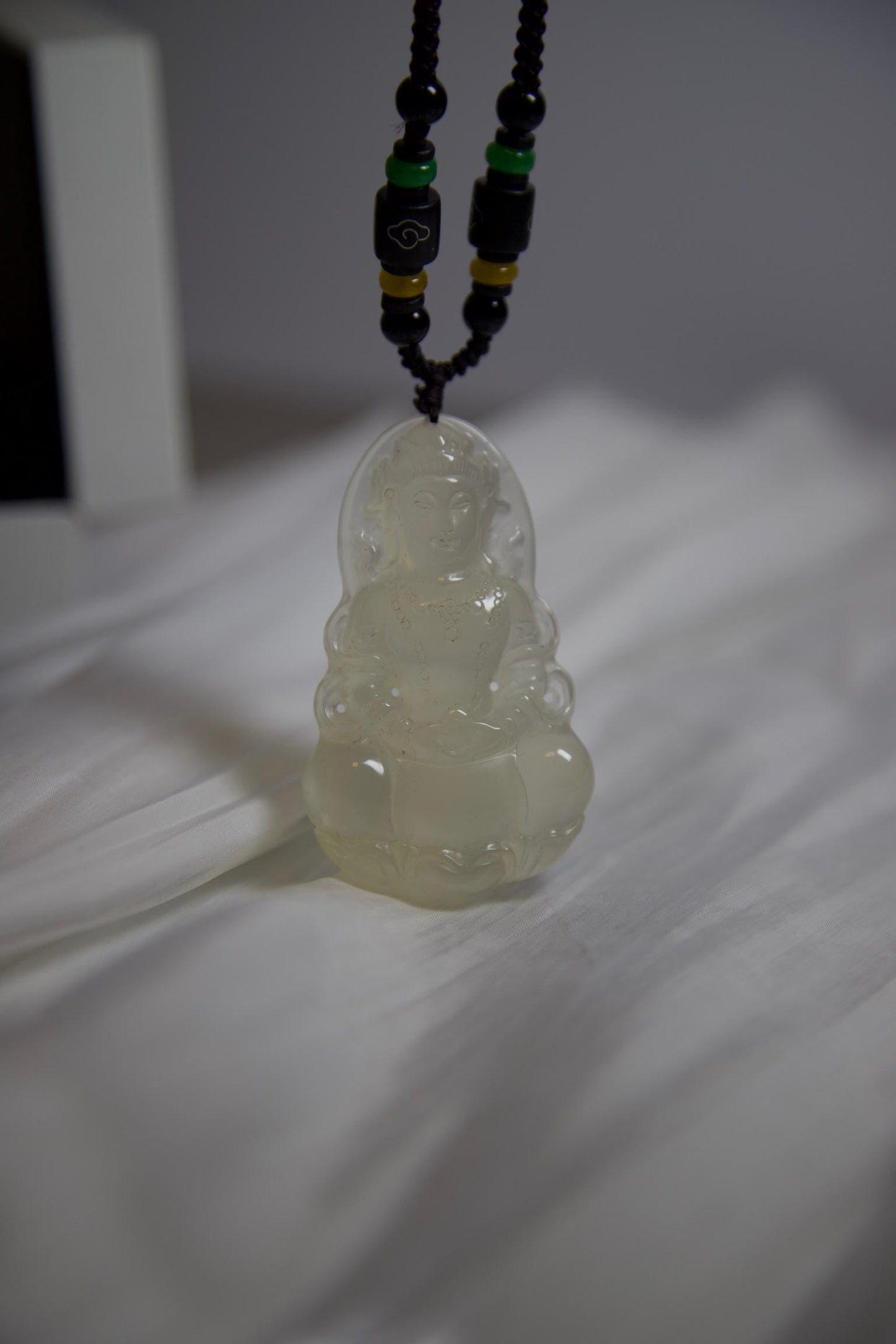 Hand-Carved Clear Jade Guanyin Pendant: Beaded Cord Amulet